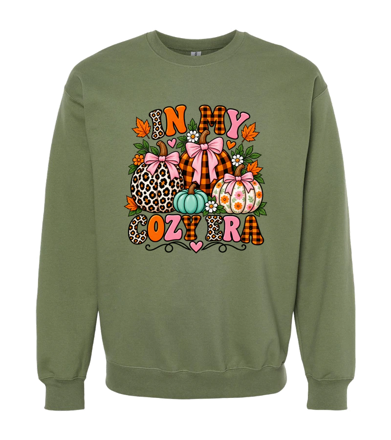 front view of In My Cozy Era on Military Green Gildan SF000 Softstyle Midweight Crewneck Sweatshirt